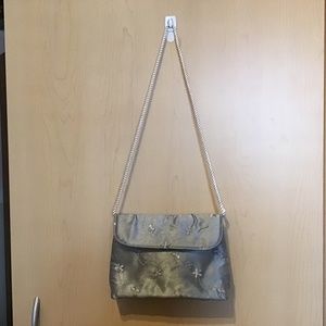 Satin embroidered evening bag with white corded handle